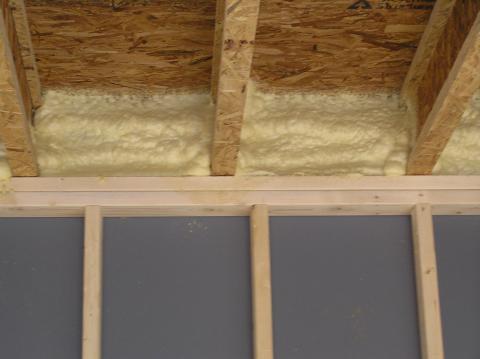 During a home cottage or commercial inspection in the Orillia, Gravenhurst,Bracebridge and Muskoka area we often find improperly installed vapour barrier Her we see the process of spraying a rim joist space in a home cottage or commercial building In this photo it is finished..