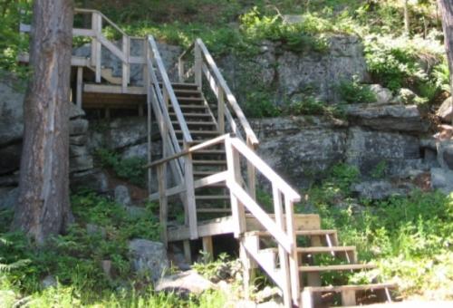 Hillside stairs not well built hand rails and supports flimsy and improper balusters.