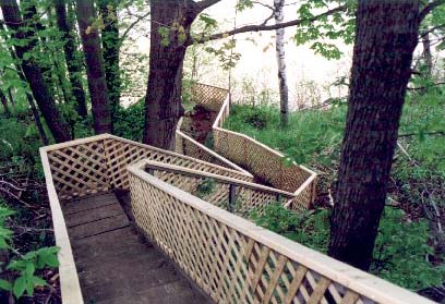 These stairs winding down a steep hillside need careful
inspections.We risk our family members lives when we ignore construction
and maintenance on this type of item around the home or cottage