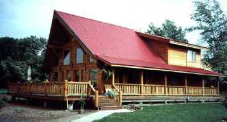 This older style yet newly built timberframe home with its extended roof line and porch protection means these owners took care to consider the elements in building this home