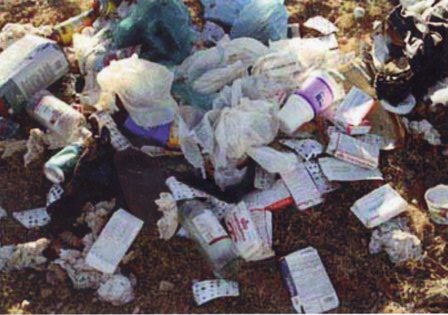 This photo shows a very large pile of trash containing chemical bottles, used coffee filters and plastic jugs just like those I might see when performing  home, cottage, and commercial, inspections in Orillia, Gravenhurst, Bracebridge, and throughout Muskoka.