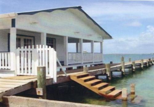 Kind of a 60s style older boathouse and attached dock, Even has stairs into the water for a quick dip.